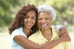 Young black woman hugging her grandma